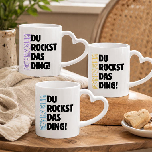 Geschenk zum Start ins Gymnasium mit Motivation für jeden Tag. Keramiktasse mit herzförmigem Henkel: Gymnasium Du rockst das…
